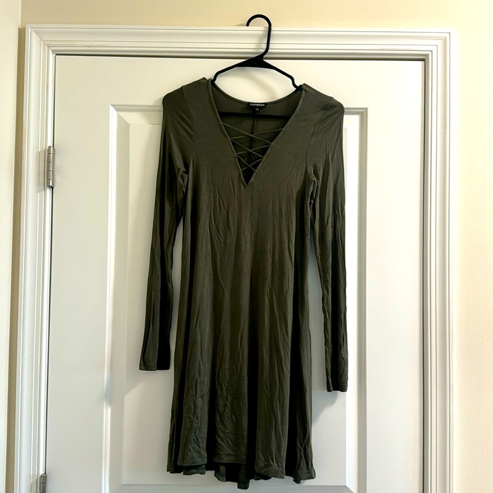 Long sleeve t shirt dress with criss cross detailing on the front.